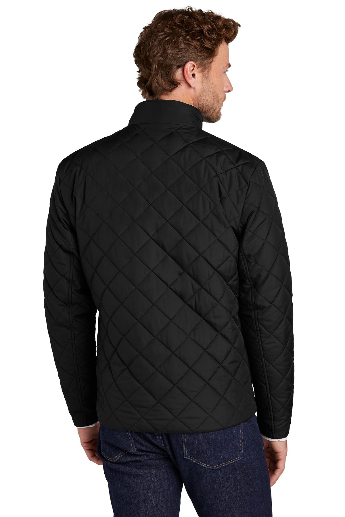Man wearing a black quilted jacket on a white background