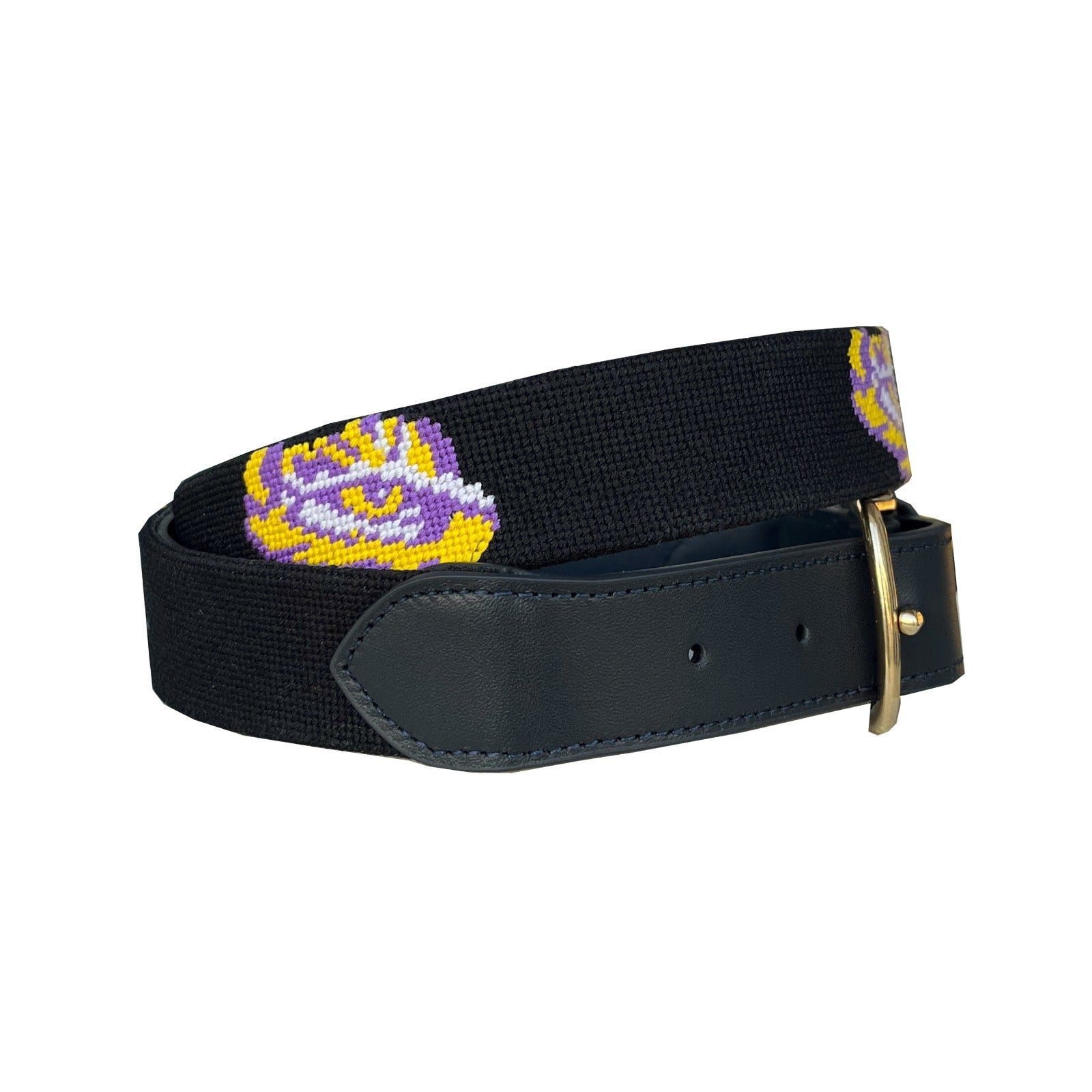 A perfect graduation gift for young men—this LSU tiger needlepoint belt features hand-stitched purple and gold, full-grain leather, and a timeless look he’ll wear from college to career.
