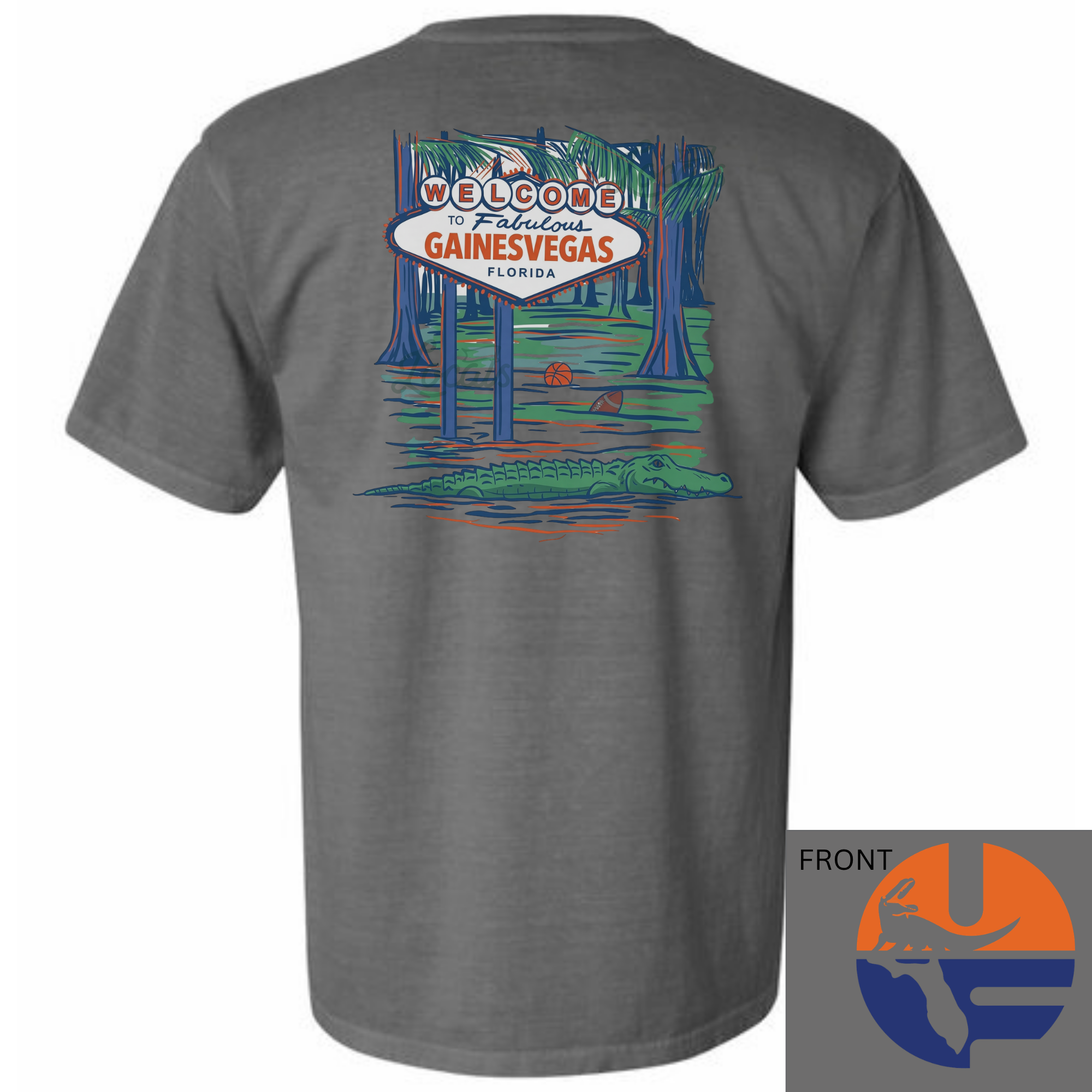 Back graphic t-shirt featuring “Welcome to Fabulous Gainesvegas Florida” sign in a swamp scene with palm trees and an alligator; front chest Florida-inspired logo; available in ivory, white, and grey.